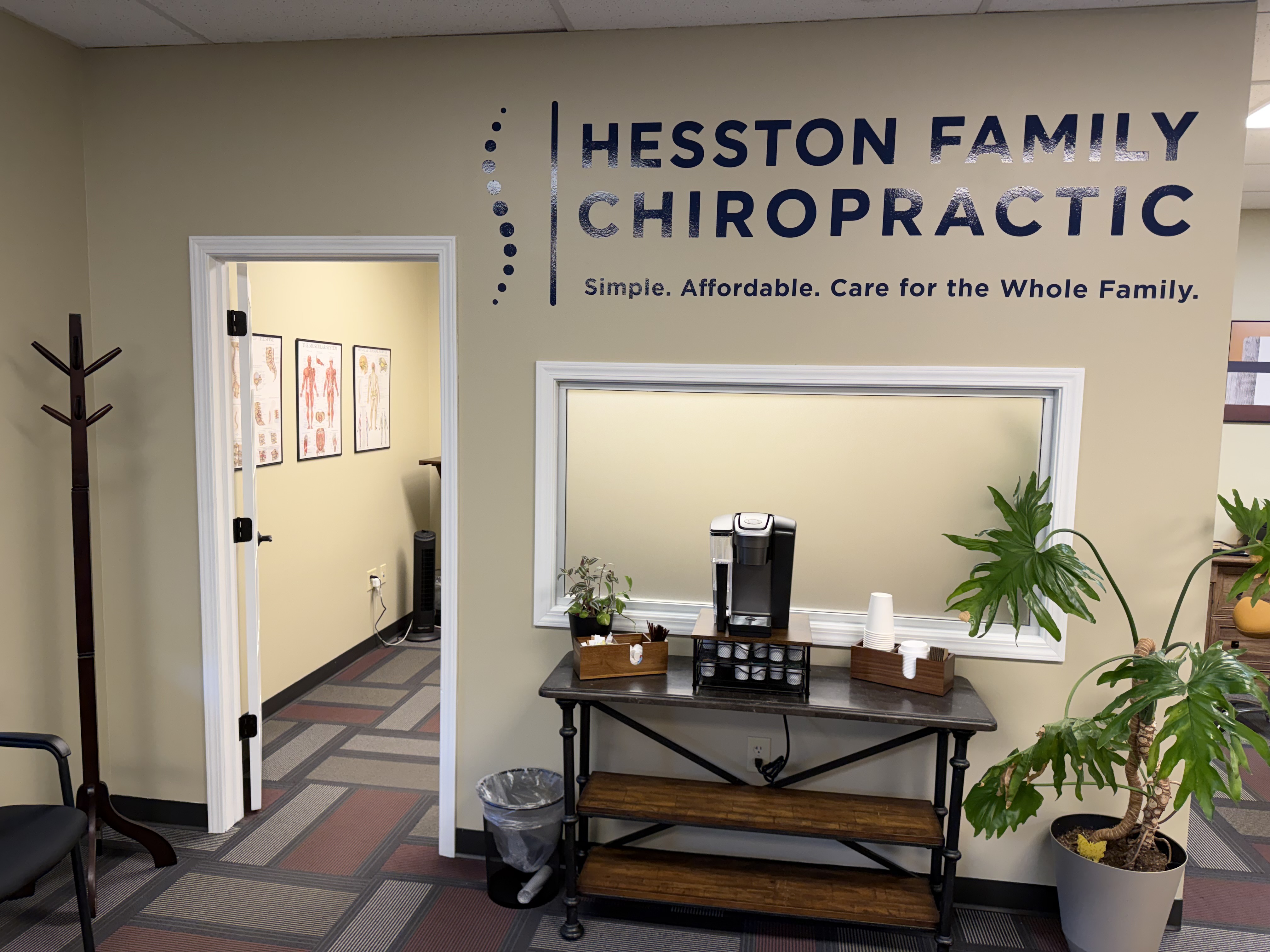 Hesston Family Chiropractic lobby with logo wall